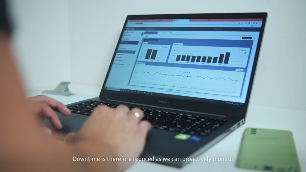 Healthcare professional using a laptop displaying Samsung's S-Hub interface with color-coded data visualization dashboard, representing Samsung's healthcare data management solution.